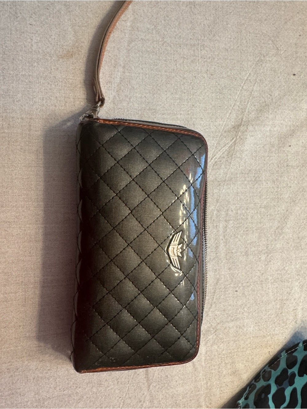 Consuela Black Quilted Wristlet Wallet with Silver Logo